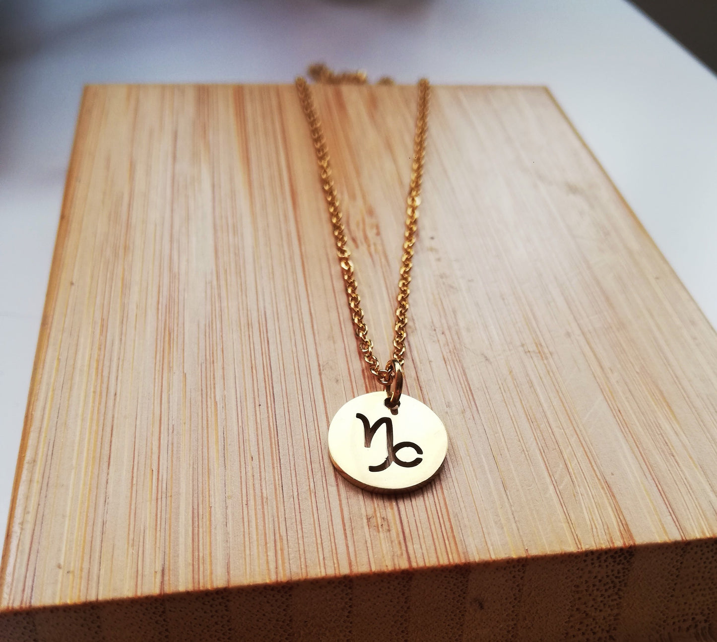 collier capricorne doré